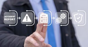 infographic displaying escalation of accident report with a man in a suit touching the icon